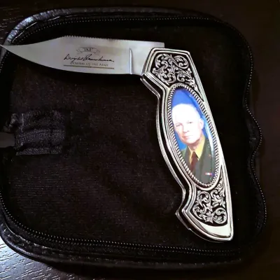 Franklin Mint collector folding pocket knife honoring General Dwight D. Eisenhower, featuring an engraved blade with his signature and a...