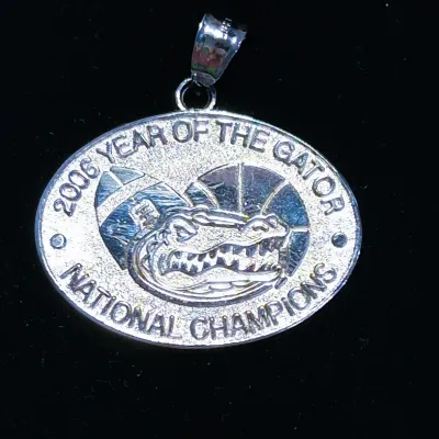 Sterling silver Florida Gators pendant commemorating the 2006 "Year of the Gator" National Championships in football and...