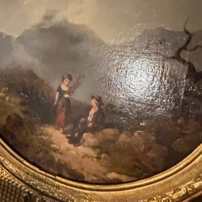 Sale Photo Thumbnail #192: Antique oil painting depicting figures in a mountainous landscape, signed J. Horlor, housed in an ornate oval gilt frame.