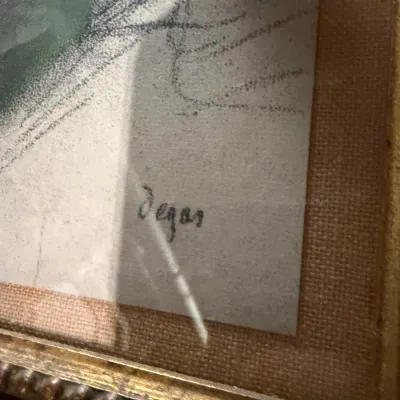 Sale Photo Thumbnail #198: Close-up of a framed artwork showing a signature that reads "Degas" in the lower corner.