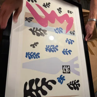 Sale Photo Thumbnail #186: Framed Henri Matisse-style abstract print featuring colorful organic cutout shapes, presented in a black frame with a white mat.