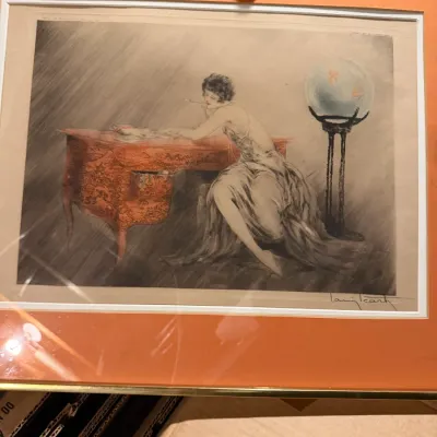 Sale Photo Thumbnail #184: Louis Icart signed Art Deco etching depicting a woman at a desk with a fishbowl, presented in an orange mat and gold-toned frame.