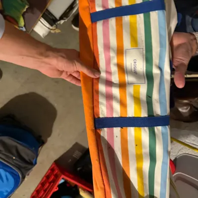 Sale Photo Thumbnail #241: Vintage-style croquet set carrying bag featuring a colorful multi-stripe pattern in orange, pink, yellow, green, and blue.