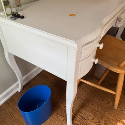 Sale Photo Thumbnail #147: White painted wooden vanity desk with curved cabriole legs, side drawers, and a matching wooden chair.