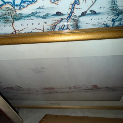 Sale Photo Thumbnail #229: Framed reproduction of a historical map depicting "Nieuw Nederland" and "Nieuw Engeland" with a gold-painted frame.