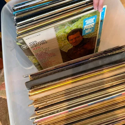 Collection of vintage vinyl LP records stored in a plastic bin, featuring Andy Williams' "Born Free" album from 1967.