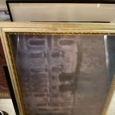 Sale Photo Thumbnail #219: Framed abstract print in a decorative gold-finished frame, shown stacked with other framed artwork.