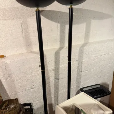 Sale Photo Thumbnail #174: Pair of vintage black metal torchiere floor lamps with brass accents and bowl-shaped shades.