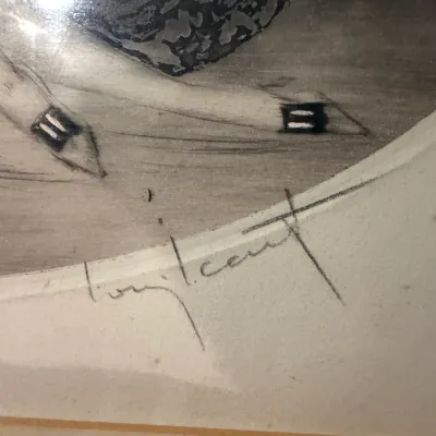 Sale Photo Thumbnail #188: Close-up detail of a signature on an Art Deco style print, likely by Louis Icart, showing the artist's signature in pencil below the image.