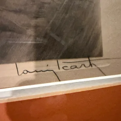 Sale Photo Thumbnail #185: Close-up detail of a Louis Icart signature on a framed artwork, showing the artist's distinctive cursive script.