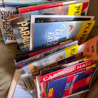 Collection of modern theater playbills and programs, including Carnegie Hall and Broadway productions like Parade and Tammy Faye.