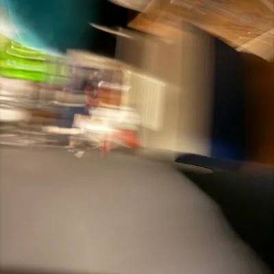 Sale Photo Thumbnail #220: Extremely blurry and out-of-focus photograph of various household items, showing significant motion blur.