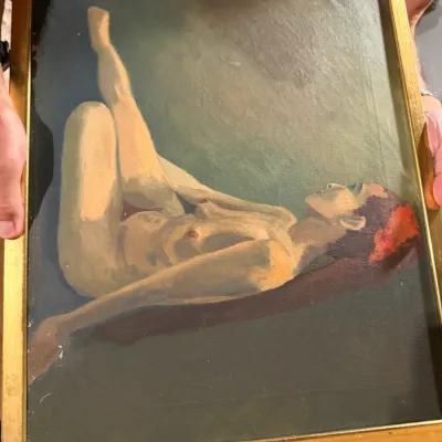 Sale Photo Thumbnail #194: Vintage oil painting depicting a stylized female nude figure, housed in a simple gold-painted wooden frame.