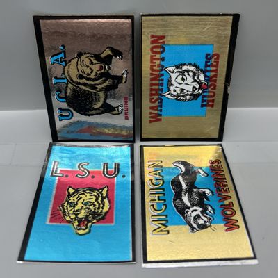 Sale Photo Thumbnail #56: (4) 1960 Topps Metallic College Football Team Stickers - UCLA, Washington, LSU, & Michigan