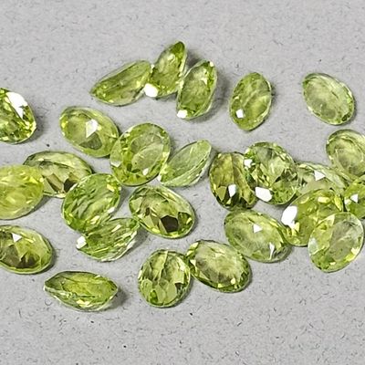 Sale Photo Thumbnail #58: Chinese Peridot Oval Faceted Gemstones 7x5MM