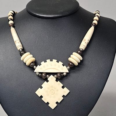Sale Photo Thumbnail #104: Carved Bone Tribal Style Pendant Necklace