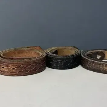 Collection of Brown and Black Tooled Leather Belts 