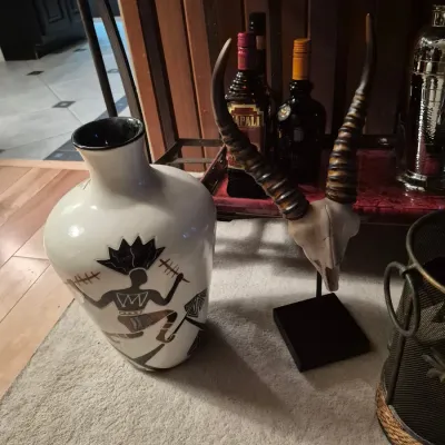 Sale Photo Thumbnail #61: Vases and miscellaneous items with tribal related themes