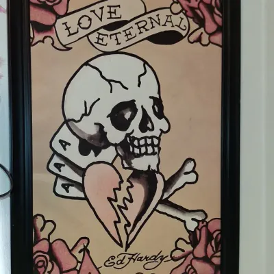Sale Photo Thumbnail #24: Framed Ed Hardy "Love Eternal" tattoo flash art print, featuring a skull, broken heart, aces, and roses in a black frame.