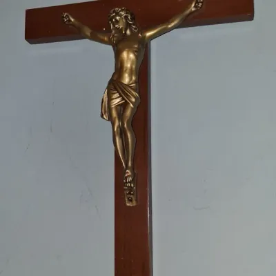 Sale Photo Thumbnail #54: Vintage wooden wall crucifix featuring a gold-toned metal corpus of Jesus Christ and an INRI plaque.