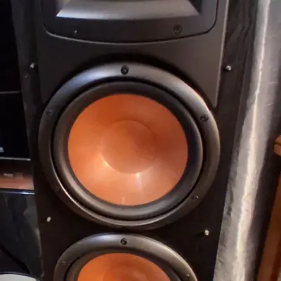 Sale Photo Thumbnail #140: Klipsch floorstanding tower speaker featuring dual copper-spun woofers and a Tractrix horn tweeter in a black cabinet.