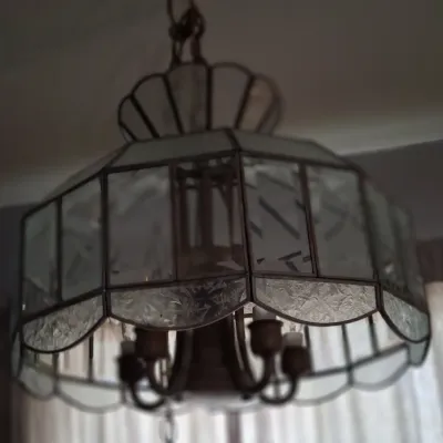Sale Photo Thumbnail #99: Vintage leaded glass hanging chandelier featuring frosted and textured glass panels with a scalloped bottom edge.