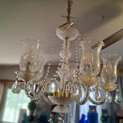 Sale Photo Thumbnail #89: Vintage crystal chandelier featuring five arms with etched glass hurricane shades and hanging crystal prisms.