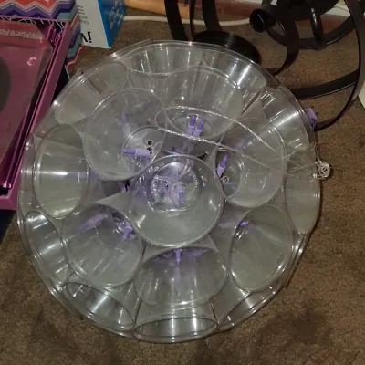 Sale Photo Thumbnail #28: Handmade sparkle ball light fixture constructed from clear plastic cups and purple string lights.