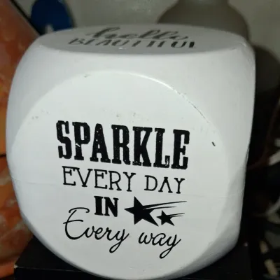 Sale Photo Thumbnail #14: White wooden decorative block with rounded corners, featuring the printed black text "SPARKLE EVERY DAY IN Every way" and shooting star graphics.