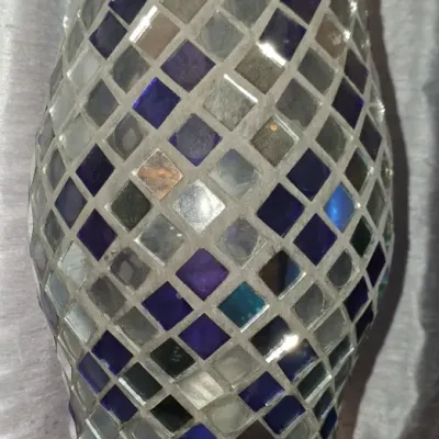 Sale Photo Thumbnail #121: Contemporary mosaic glass table lamp featuring a diamond pattern of blue, silver, and mirrored tiles on a silver-tone base.