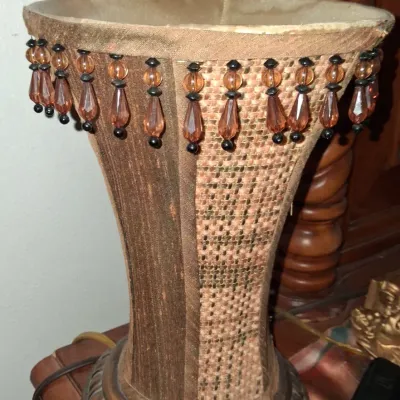 Sale Photo Thumbnail #35: Vintage table lamp featuring a flared fabric shade with beaded fringe detailing and a textured, woven panel design.