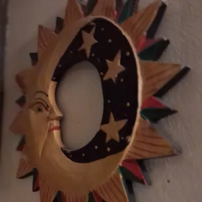 Sale Photo Thumbnail #83: Hand-painted wooden celestial wall hanging featuring a sun and crescent moon design with stars, showing some minor wear.
