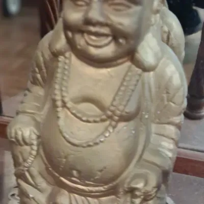 Sale Photo Thumbnail #97: Vintage gold-painted laughing Buddha statue, depicted standing with a joyful expression and wearing prayer beads.