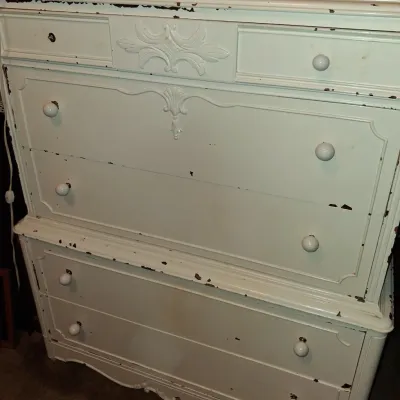 Sale Photo Thumbnail #44: Vintage French Provincial style chest of drawers painted in off-white, featuring distressed edges, carved details, and matching round knobs.