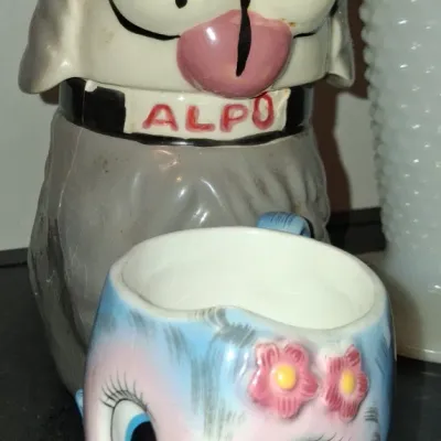 Sale Photo Thumbnail #74: Vintage ceramic Alpo dog cookie jar alongside a mid-century Lefton-style bluebird planter.