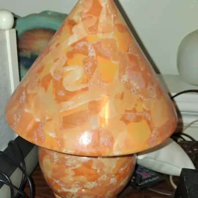Sale Photo Thumbnail #15: Vintage orange and cream alabaster or marble mushroom lamp, featuring a conical shade and matching rounded base.