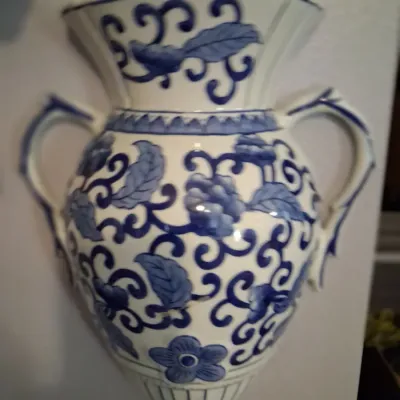 Sale Photo Thumbnail #96: Chinoiserie blue and white ceramic wall pocket vase with dual handles and floral scroll motifs.