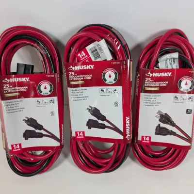 Sale Photo Thumbnail #110: Three Husky 25-foot, 14-gauge indoor/outdoor extension cords in red and black, new in their original packaging.