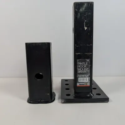 Sale Photo Thumbnail #136: Buyers Products pintle hook mount and a receiver tube adapter, both in black-finished heavy-duty steel showing light wear.