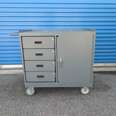 Sale Photo Thumbnail #9: Industrial gray metal rolling tool cart featuring four lockable drawers, a large side cabinet, and a push handle.