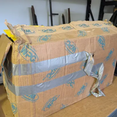 Sale Photo Thumbnail #66: WPG Wood's Powr-Grip branded cardboard box, heavily worn and reinforced with duct tape.