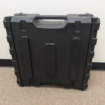 Sale Photo Thumbnail #284: Heavy-duty black molded plastic carrying case with integrated handle, suitable for tools or equipment.
