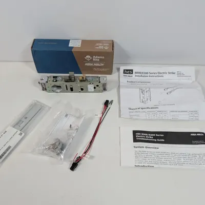 Sale Photo Thumbnail #148: Assa Abloy HES 8000/8300 series electric strike kit, including the strike body, faceplate, wiring harness, installation instructions, and troubleshooting guide.
