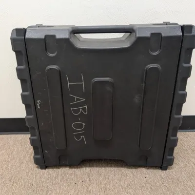 Sale Photo Thumbnail #291: Heavy-duty black molded plastic equipment carrying case with integrated handle, marked with handwritten identification 'IAB-015'.