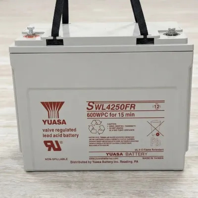 Sale Photo Thumbnail #67: Yuasa SWL4250FR valve regulated lead acid battery, 600WPC for 15 minutes, in clean, non-spillable condition with carrying strap.