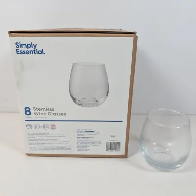 Sale Photo Thumbnail #119: Simply Essential 8-piece stemless wine glass set, 12 oz capacity, shown with one glass out of the original box.