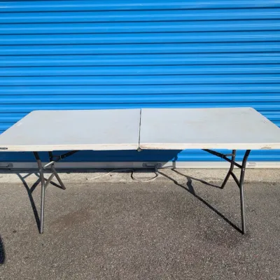 Sale Photo Thumbnail #62: Lifetime brand white plastic folding utility table with metal legs, showing some light wear and surface scuffs.