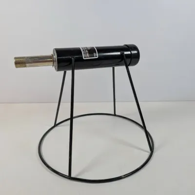 Sale Photo Thumbnail #297: Black metal stand featuring a cylindrical body with a threaded metal nozzle, showing light wear.