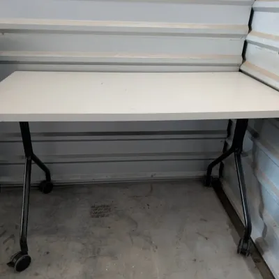 Sale Photo Thumbnail #28: Modern white laminate training table with black metal legs on casters.