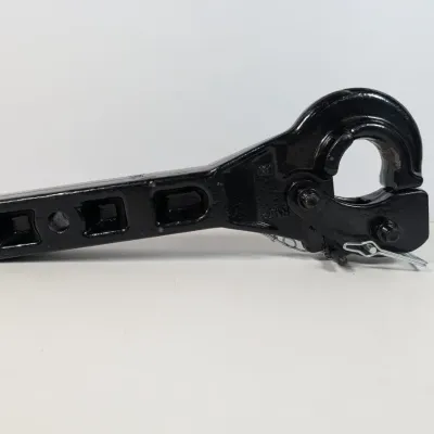 Sale Photo Thumbnail #135: Heavy-duty black metal pintle hook receiver mount with a safety pin, showing minimal wear.